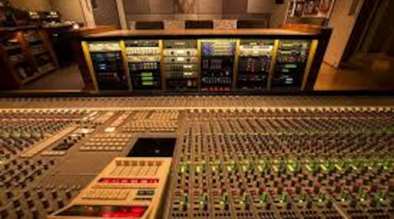 A Super Sound Studios employee exchanged gunfire with two armed men he saw entering the facility early Wednesday morning, police said.