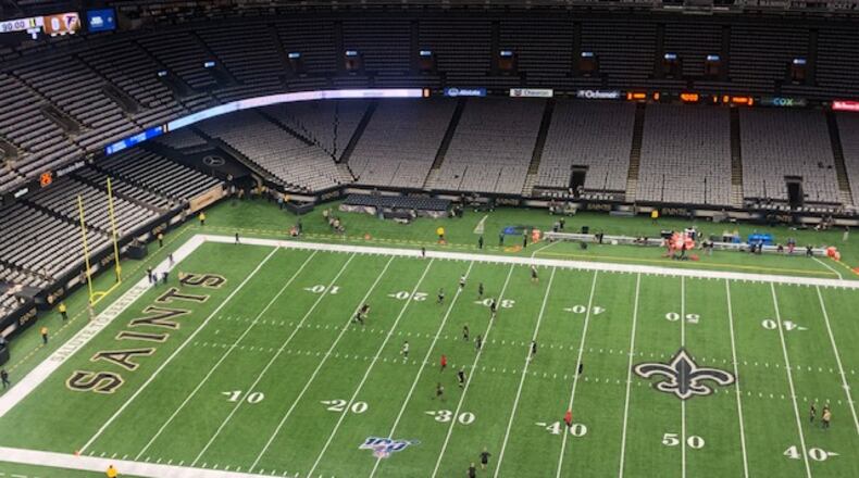Falcons inactives and practice squad players warming up on Sunday. (By D. Orlando Ledbetter/dledbetter@ajc.com)