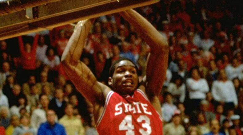 North Carolina State's Lorenzo Charles completes the game-winning dunk against Houston. (Photo by Rich Clarkson of Sports Illustrated)
