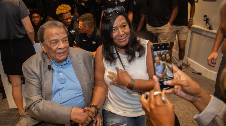 Andrew Young poses for a photo with the participants at the end of the Hank Aaron Invitational at  SunTrust Park in Atlanta August 2, 2019.  STEVE SCHAEFER / SPECIAL TO THE AJC