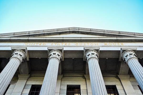 The U.S. Custom House in downtown Savannah, with it's solid granite Corinthian-style columns, is among the federal buildings being discussed for potential sale. (Sarah Peacock for the AJC)