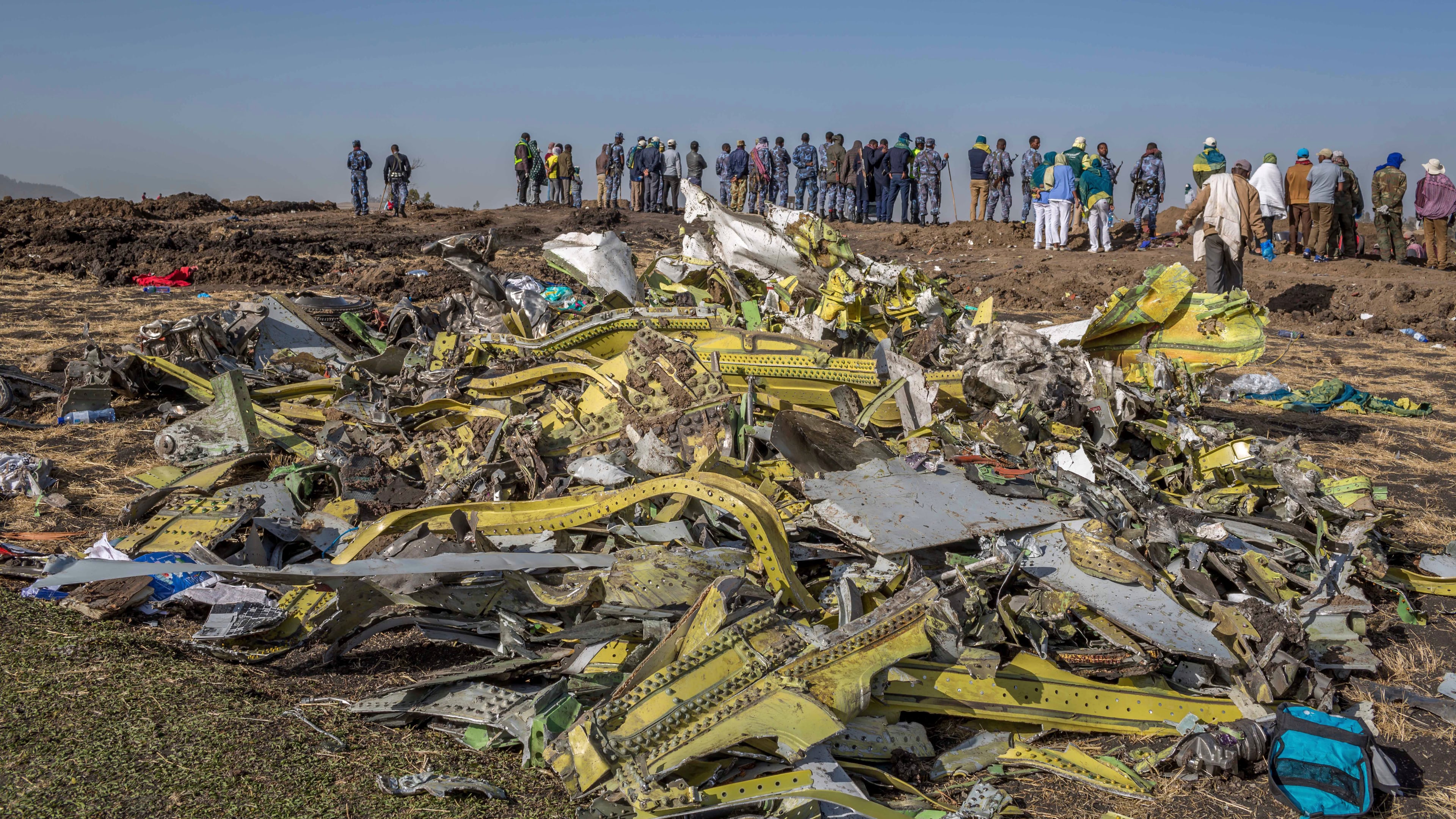 FILE - Wreckage is piled at the crash scene of Ethiopian Airlines flight ET302 near Bishoftu, Ethiopia, March 11, 2019. (AP Photo/Mulugeta Ayene, File)
