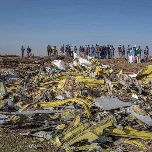 FILE - Wreckage is piled at the crash scene of Ethiopian Airlines flight ET302 near Bishoftu, Ethiopia, March 11, 2019. (AP Photo/Mulugeta Ayene, File)