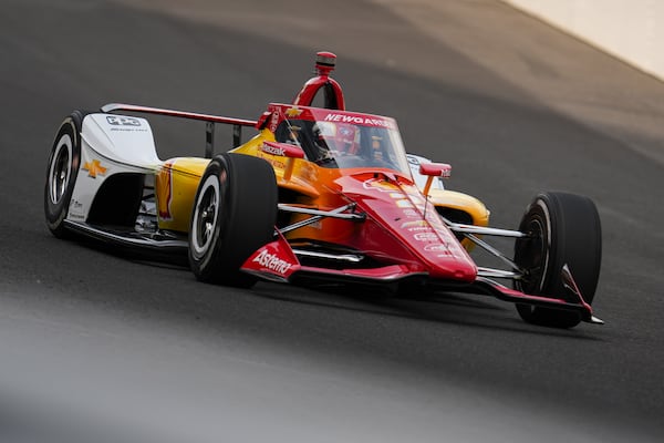 Josef Newgarden drives through the first turn during practice for the Indianapolis 500 auto race at Indianapolis Motor Speedway in Indianapolis, Thursday, May 15, 2025. (AP Photo/Michael Conroy)