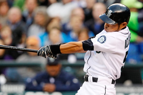 FILE - Seattle Mariners' Ichiro Suzuki hits a home run in the first inning of a baseball game against the Cleveland Indians, Wednesday, April 18, 2012, in Seattle. (AP Photo/Elaine Thompson, File)