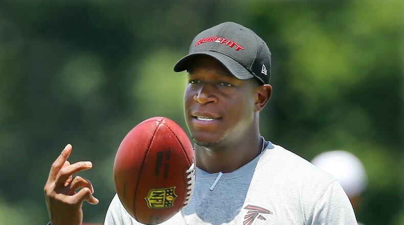061615 FLOWERY BRANCH: Falcons assistant head coach Raheem Morris watches over practice as the team opens a 3 day mini-camp open to the public on Tuesday, June 16, 2015, in Flowery Branch. Curtis Compton / ccompton@ajc.com