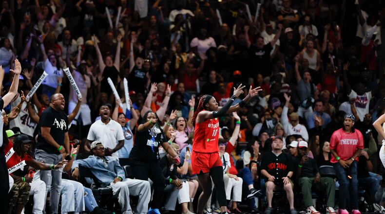 Dream guard Rhyne Howard celebrates after hitting a 3-pointer against the Indiana Fever at Gateway Center Arena on Thursday, Sept. 18, 2024, in Atlanta. The WNBA team is building quite a fan base. (Miguel Martinez/AJC 2024)