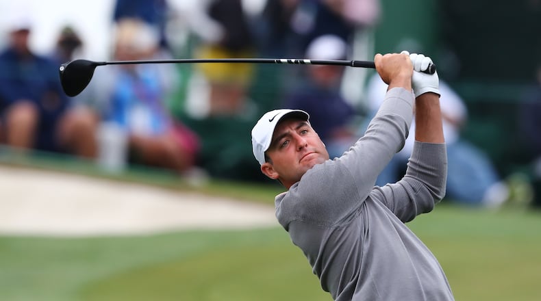 Scottie Scheffler tees off on the third hole during his practice round Tuesday for the Masters. (Curtis Compton / Curtis.Compton@ajc.com)