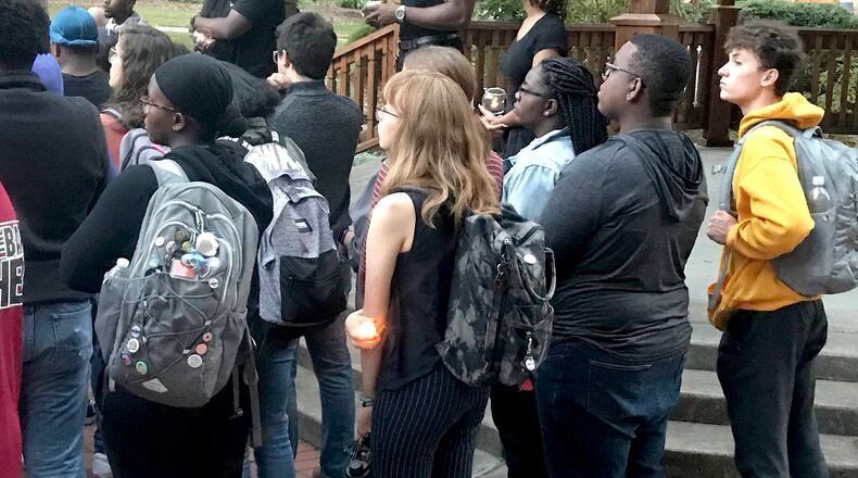 Hundreds attended a vigil Monday night on the KSU campus to honor Femi Oyerinde, a freshman shot to death outside his apartment on Oct. 6.