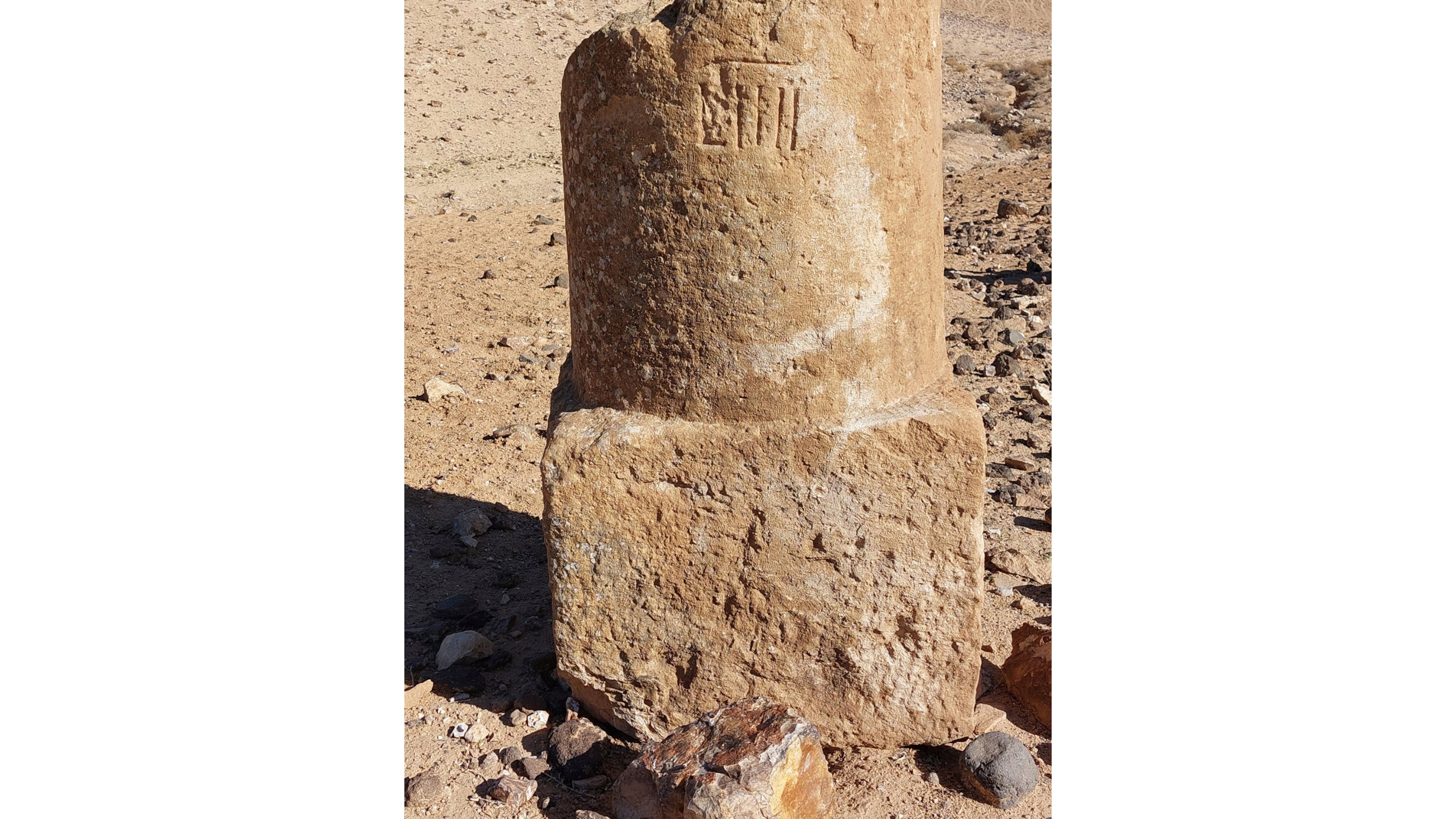 This photo provided by Adam Pažout shows a fragment of a Roman milestone that was erected along the road Via Nova Traiana in Jordan. (Adam Pažout/Itiner-e via AP)