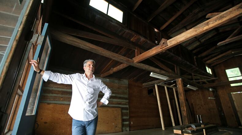 Mark Allen, owner of Lazy Guy Distillery, is shown at the home of his distillery, an old barn dating back to the 1830s, Tuesday afternoon in Kennesaw, Ga., June 11, 2013.