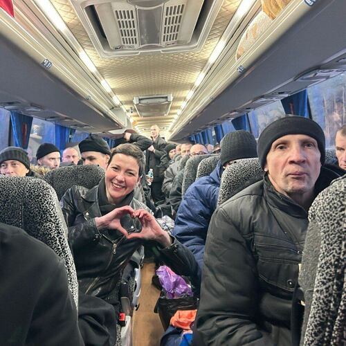 In this photo provided by the Press Service Of Coordination Headquarters for the Treatment of Prisoners of War on Saturday, Dec 13, 2025, Maria Kolesnikova, key Belorussian opposition figure, shows a sign of love siting in a bus after been released from detention in Belarus, at the Ukrainian Belorussian border. (Press Service Of Coordination Headquarters for the Treatment of Prisoners of War via AP)