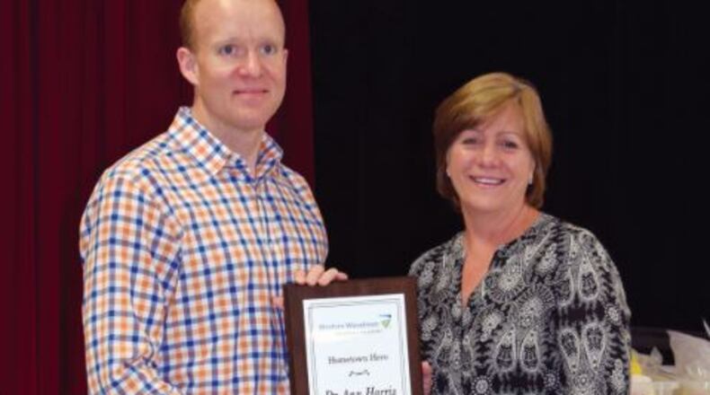 Carmel Elementary School teacher Dr. Ann Harris is recognized by Modern Woodmen member Garth Gherardini as a Hometown Hero.