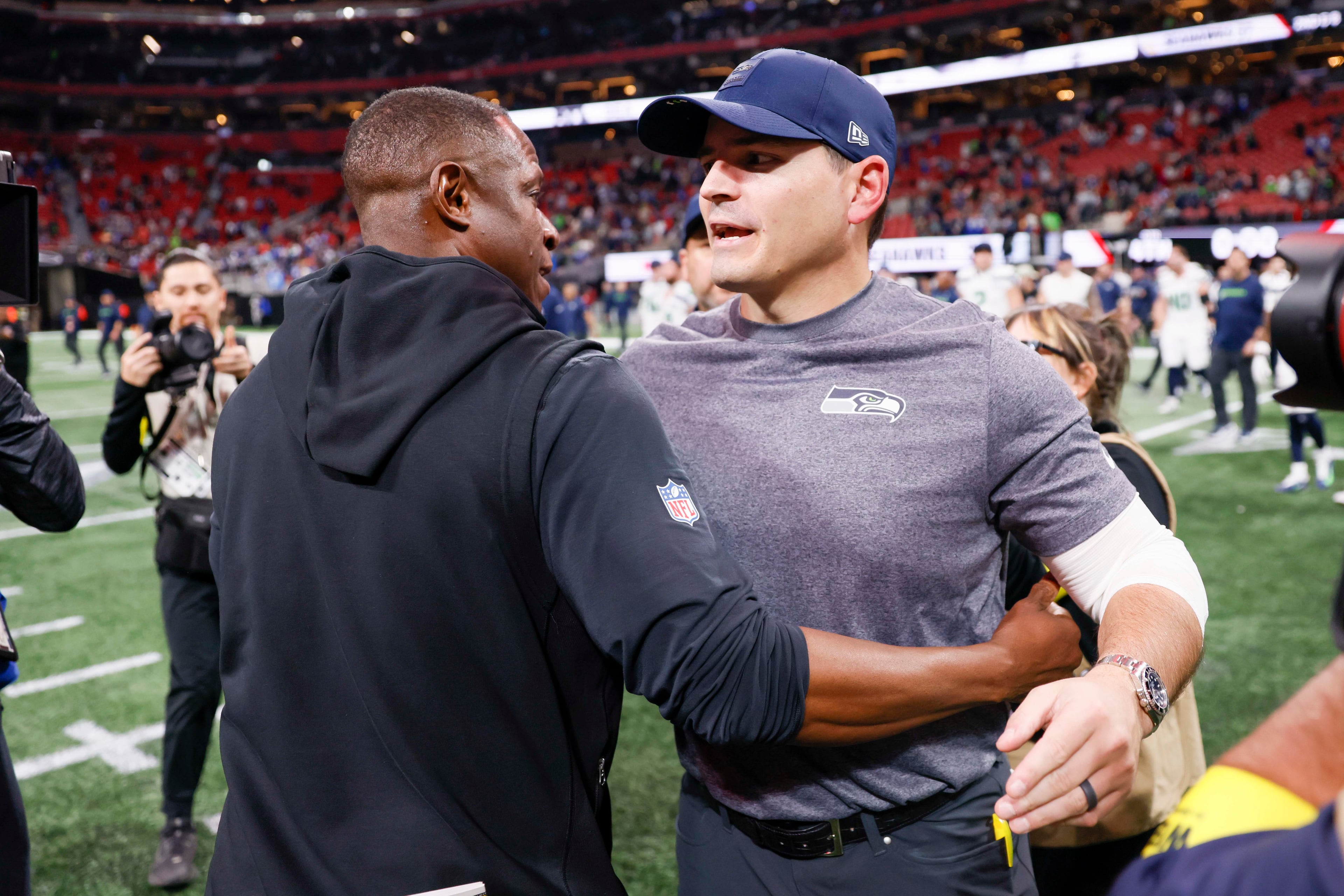 Atlanta Falcons head coach Raheem Morris speaks with Seattle Seahawks head coach Mike MacDonald after the game, in which the Seahawks defeated the Falcons 37-9 at Mercedes-Benz Stadium in Atlanta on Sunday, Dec. 7, 2025. (Miguel Martinez/ AJC)