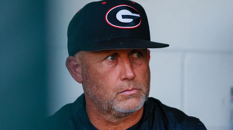 Georgia coach Wes Johnson watches his team jump onto the field moments before the game against the Florida Gators at Foley Field on Tuesday, May 16, 2024, in Athens. (Miguel Martinez / AJC)
