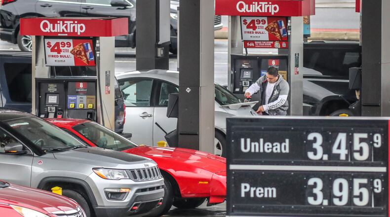 Motorists fuel up at the QuikTrip located at Spring Road and Cumberland Boulevard in Cobb County on Friday. Gasoline prices have climbed in metro Atlanta and around the nation. Russia’s invasion of Ukraine this week sparked predictions of still higher prices. (John Spink / John.Spink@ajc.com)