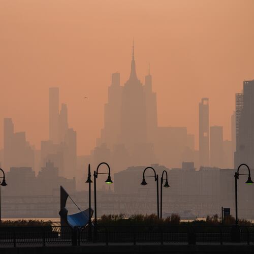 The New York City skyline is seen through a cover of wildfire smoke, in Jersey City, N.J., Friday, July 17, 2026. (AP Photo/Ryan Murphy)