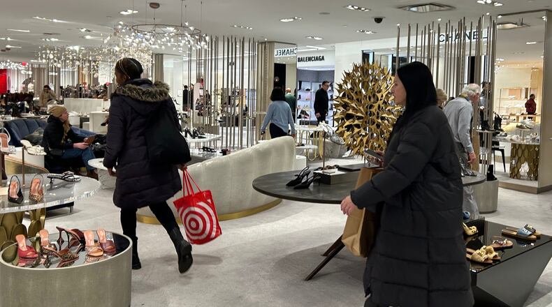 FILE - Shoppers walk through Saks Fifth Avenue, Jan. 16, 2026 in New York. (AP Photo/Anne D'Innocenzio, File)