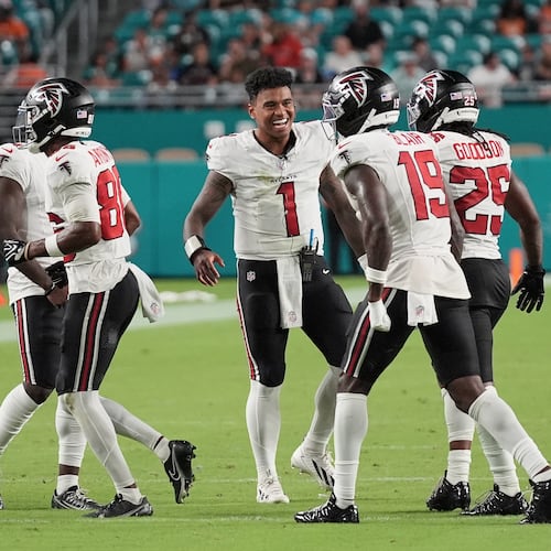 Atlanta Falcons quarterback Tua Tagovailoa (1) celebrates with teammates during the first half of an NFL preseason football game against the Miami Dolphins, Friday, Aug. 28, 2026, in Miami Gardens, Fla. (AP Photo/Lynne Sladky)