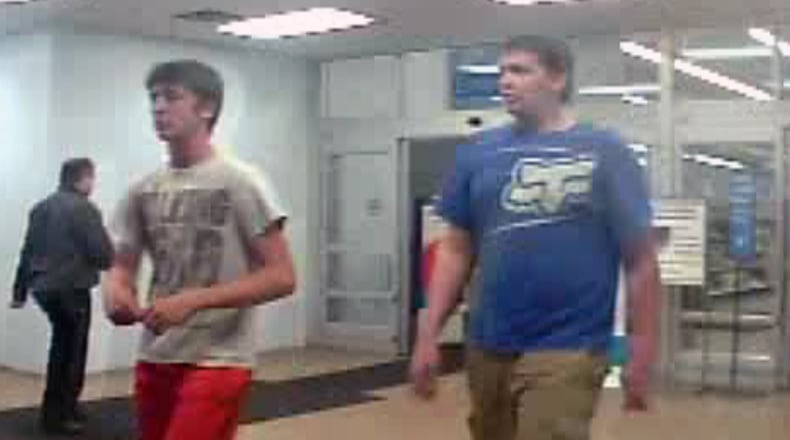 Two men are seen in surveillance footage at a Walmart in Millington, Tennessee, after police say they intentionally poured insecticide in the children's toy department of a Walmart on Sunday, Oct. 22, 2017.