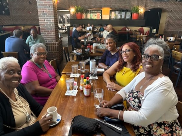 Brenda Stevenson (left) and Venis Sims (right) join Christian Ross (second from right) and friends at a Summer Listening Tour luncheon for Happy Talks. (Courtesy of Christian Ross)