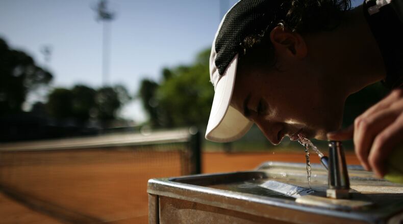 A student drinks from the water fountain at the Villas tennis club in Buenos Aires, Argentina, in a 2008 file photo.