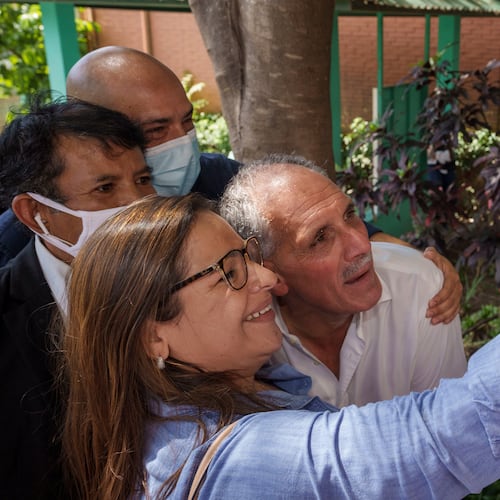 FILE - National Party presidential candidate Nasry Asfura poses for a selfie with a supporter, after voting at a polling station in the general elections in Tegucigalpa, Honduras, Nov. 28, 2021. (AP Photo/Moises Castillo, File)