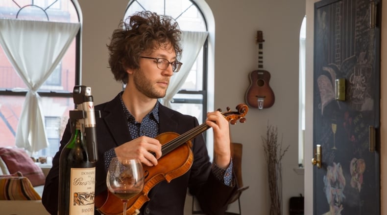Rob Moose, a rock guitarist, violinist and producer, with his Coravin, which acts like a hypodermic syringe to draw out wine while fending off oxidation, in New York, Oct. 23, 2015. When clasped around a bottle’s throat, the tool pierces the cork with a hollow surgical-grade needle and injects argon, an inert gas, creating pressure and forcing a small amount of wine out through the needle while protecting the remainder from oxidation.