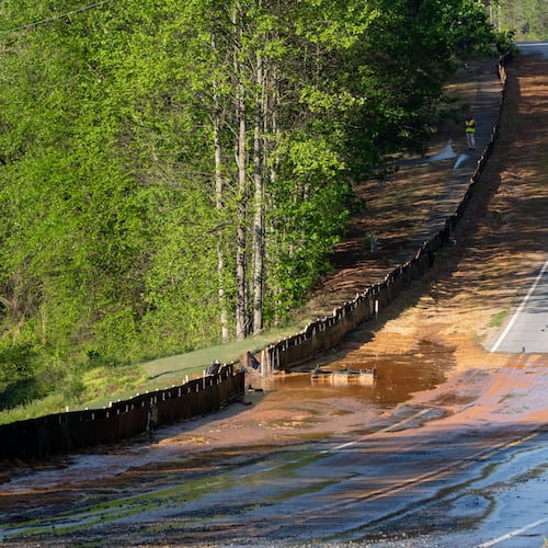 A section of Buford Highway, between Duluth and Suwanee, is closed as crews repair a water main break on Tuesday, April 14, 2026. (Ben Hendren for the AJC)