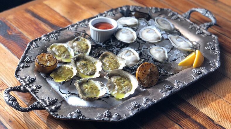Platter of oysters, half grilled and half raw, at Kimball House in Decatur. CONTRIBUTED BY: Kimball House
