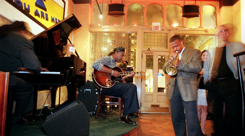 A jazz ensemble plays while patrons enter Churchill Grounds next to the Fox Theater in Atlanta on October 12, 1999.