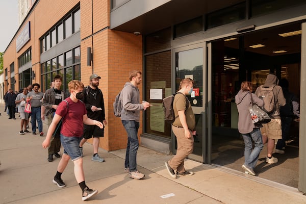 People line up outside a Target store for the new Nintendo Switch 2 video game consoles on Thursday, June 5, 2025 in Chicago. (AP Photo/Kiichiro Sato)