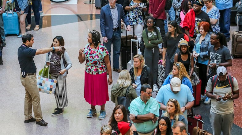 May 26, 2017 Hartsfield-Jackson International Airport: With tens of thousands of travelers heading to Hartsfield-Jackson International Airport for Memorial Day trips, some security lines were long but moved quickly Friday morning, May 26, 2017. The Memorial Day weekend marks the unofficial start of the busy summer travel season. Friday is expected to be the busiest day of the holiday travel weekend, according to the airport, and may break a record for passengers processed at security checkpoints. More than 85,000 are expected to pass through Hartsfield-Jackson security checkpoints Friday. The airport aims to keep wait times under 20 minutes, but lines are longer during peak times. Airport and Transportation Security Administration officials recommend travelers get to the airport two hours before domestic flights and three hours before international flights. GDOT is suspending construction-related lane closures on interstate highways from noon Friday through 5 a.m. Tuesday. Itâs also limiting lane closures on state routes that directly serve major tourist and recreation centers. Memorial Day weekend is one of the heaviest travel times of the year, said State Construction Engineer John Hancock. âWe hope the suspension of major construction work will allow motorists to get to and from their holiday festivities with less congestion and less aggravation,â he said. JOHN SPINK/JSPINK@AJC.COM