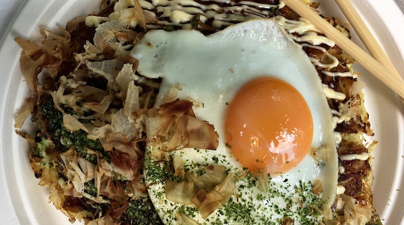 The pleasure of okonomiyaki at Ok Yaki is all about contrasting textures and flavors. CONTRIBUTED BY WYATT WILLIAMS