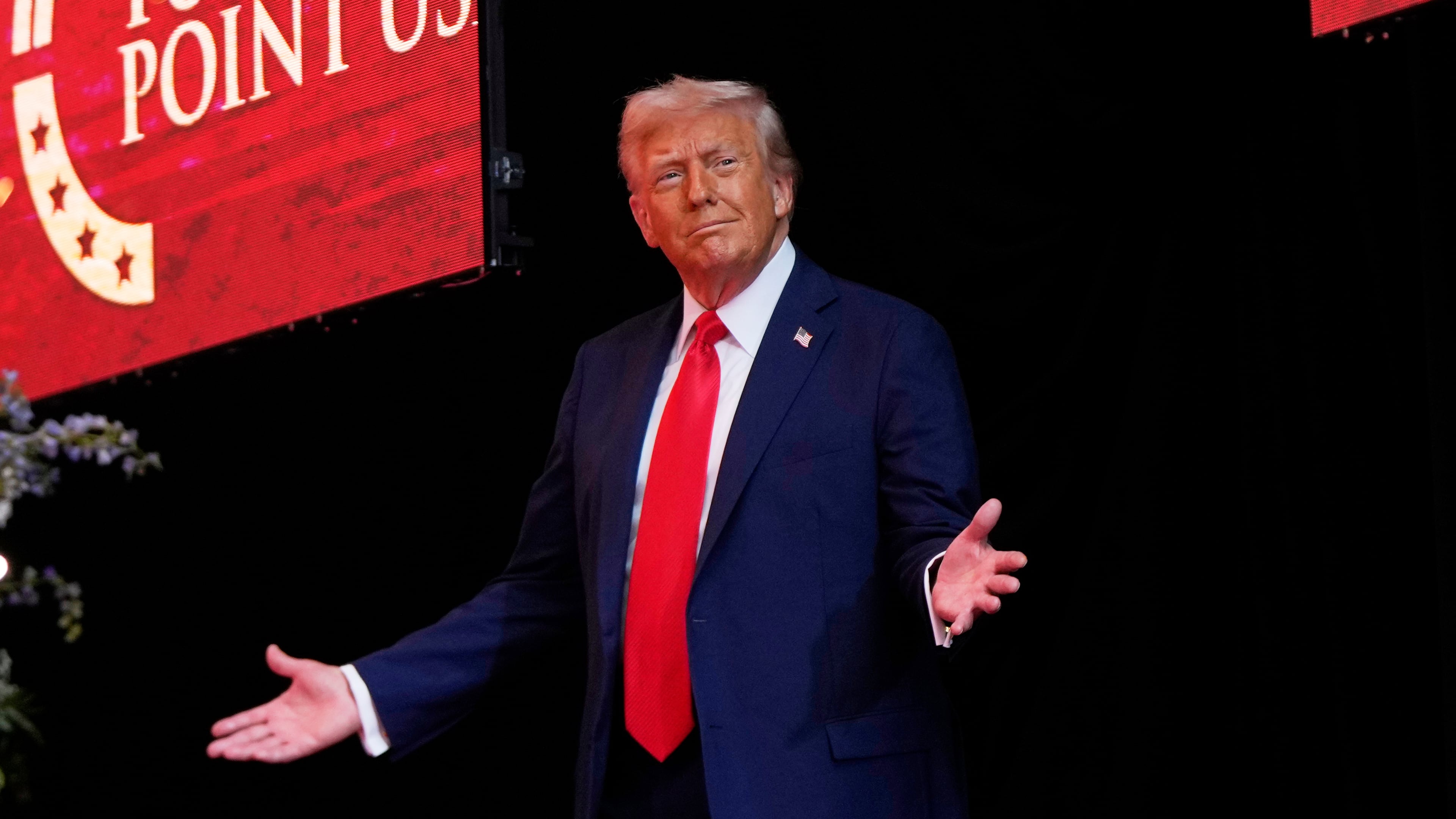 President Donald Trump arrives to speak at a memorial for conservative activist Charlie Kirk, Sunday, Sept. 21, 2025, at State Farm Stadium in Glendale, Ariz. (AP Photo/Julia Demaree Nikhinson)