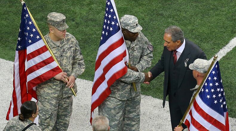 Falcons owner Arthur Blank thanks soldiers for their service in the "Salute to Service" game between the Falcons and the Seahawks in honor of Veteran's Day in 2013. (AJC file/Curtis Compton)