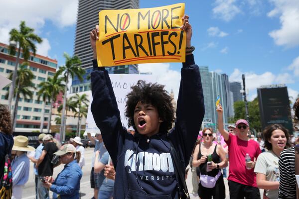 Paul Ivanov chants slogans during a protest against the Trump administration, Saturday, April 19, 2025, in Miami. (AP Photo/Lynne Sladky)