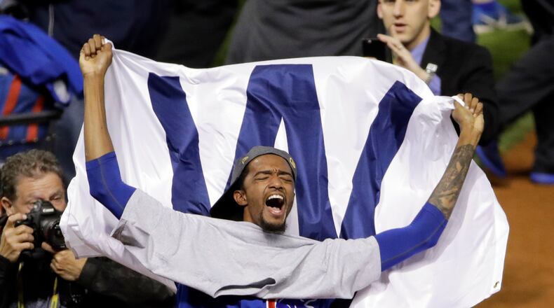 Chicago Cubs' Carl Edwards celebrates after Game 7 of the Major League Baseball World Series against the Cleveland Indians Thursday, Nov. 3, 2016, in Cleveland. The Cubs won 8-7 in 10 innings to win the series 4-3. (AP Photo/Gene J. Puskar)