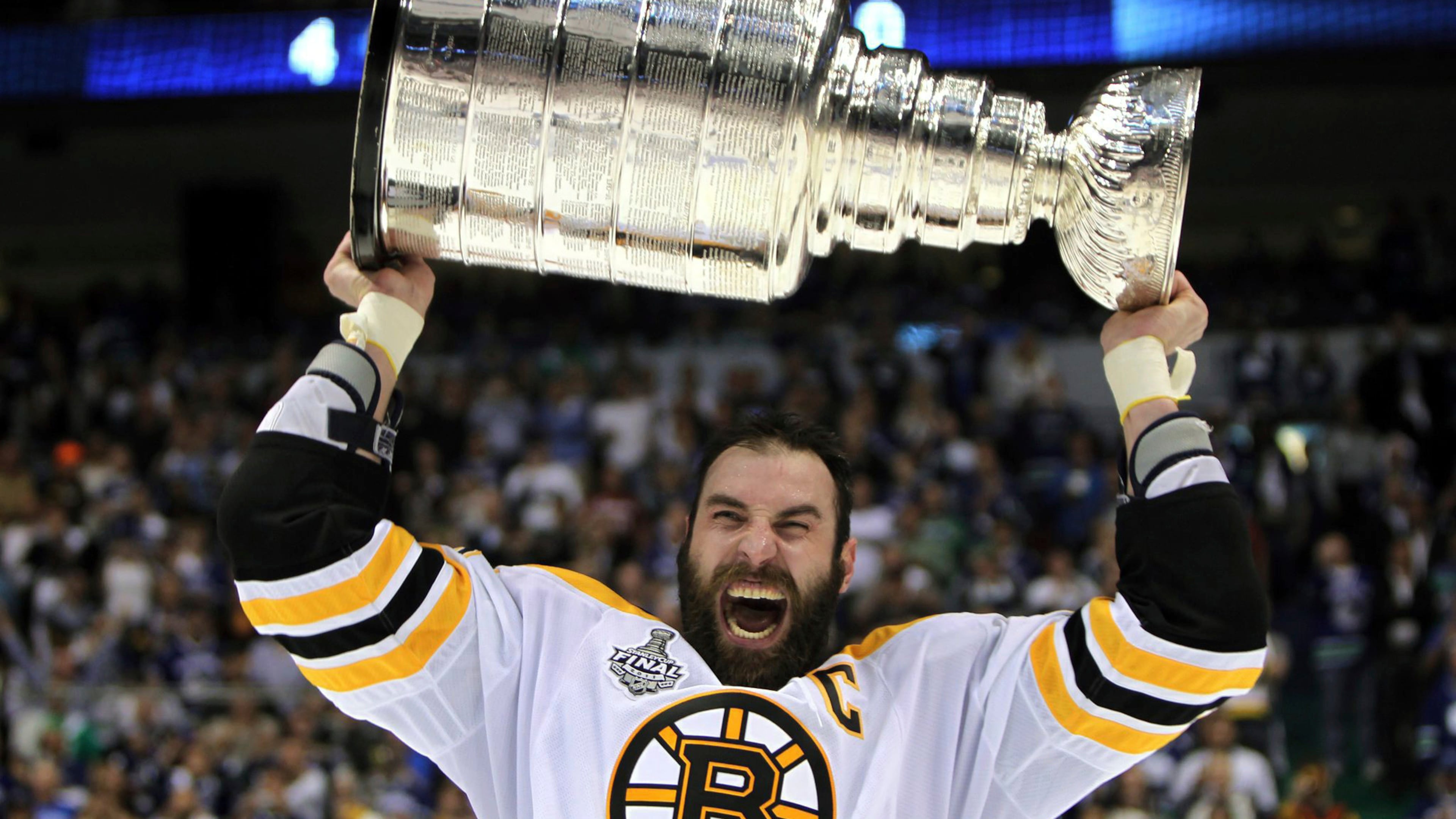 FILE - Boston Bruins' Zdeno Chara, of Slovakia, hoists the cup following the Bruins' 4-0 win over the Vancouver Canucks in Game 7 of the NHL hockey Stanley Cup Finals on June 15, 2011, in Vancouver, British Columbia, Canada. (Jonathan Hayward/The Canadian Press via AP)