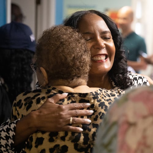 Former Atlanta Mayor Keisha Lance Bottoms hugs a supporter during a visit to the Kidz.com Child Development Center in Columbus on May 12, 2026, as part of her final statewide push ahead of the Democratic gubernatorial primary election. (Riley Bunch/AJC)