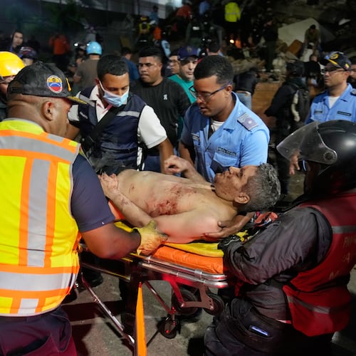 Rescue worker carry an injured man after an earthquake in Caracas, Venezuela, Wednesday, June 24, 2026. (AP Photo/Ariana Cubillos)