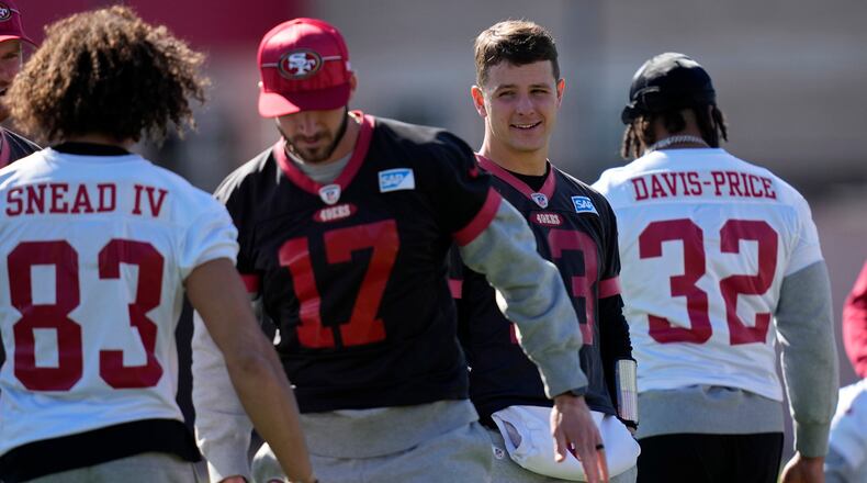 San Francisco 49ers quarterback Brock Purdy, second from right, watches during a practice ahead of the Super Bowl 58 NFL football game Saturday, Feb. 10, 2024, in Las Vegas. (AP Photo/John Locher)