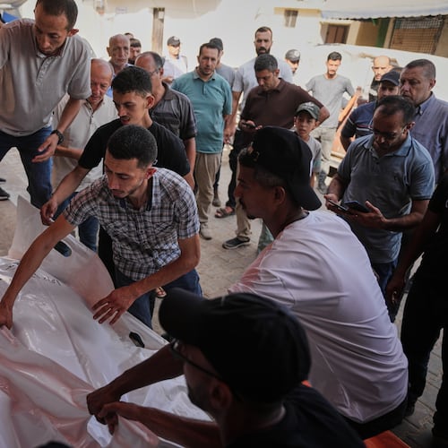 Mourners carry the bodies of Kamal Abu Muailiq, 68, and his wife, Huda Abu Muailiq, 59, who were killed in an Israeli airstrike, during their funeral in Deir al-Balah, Gaza Strip, Sunday, Aug. 2, 2026. (AP Photo/Abdel Kareem Hana)