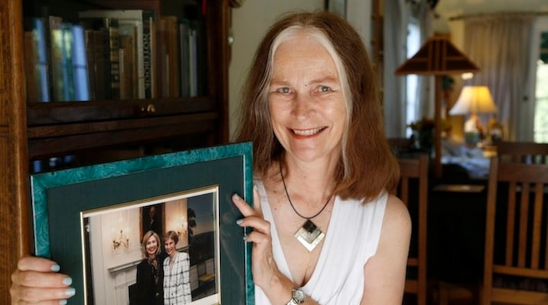 Cheryl Lawson Walker holds a photo of her with Hillary Clinton, at her house in Los Angeles. On the day Lawson graduated from Wellesley College, for the first time, a student had been selected to address the commencement at the women's school. The speech by Hillary Rodham, student government president, sent a jolt through the class. Walker recalls Rodham was "much more forward-looking” than many of her classmates, and it would be years before they, too, recognized the chauvinism they would have to overcome once they left school. (AP Photo/Nick Ut)