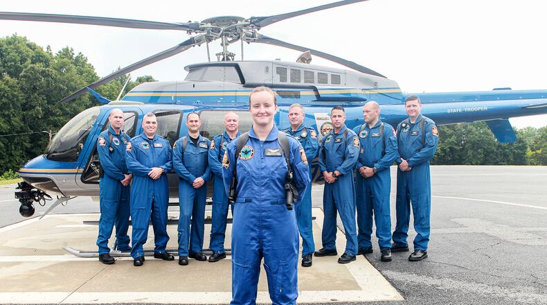 Trooper Haley Jo Lucas (front) is the first female pilot for the Georgia State Patrol.
