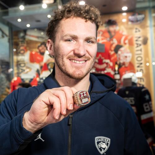 Florida Panthers' Matthew Tkachuk shows fans the team's 2025 Stanley Cup ring before placing it inside the display at the Hockey Hall of Fame in Toronto, Canada, on Tuesday, Jan. 6, 2025. (Eduardo Lima/The Canadian Press via AP)