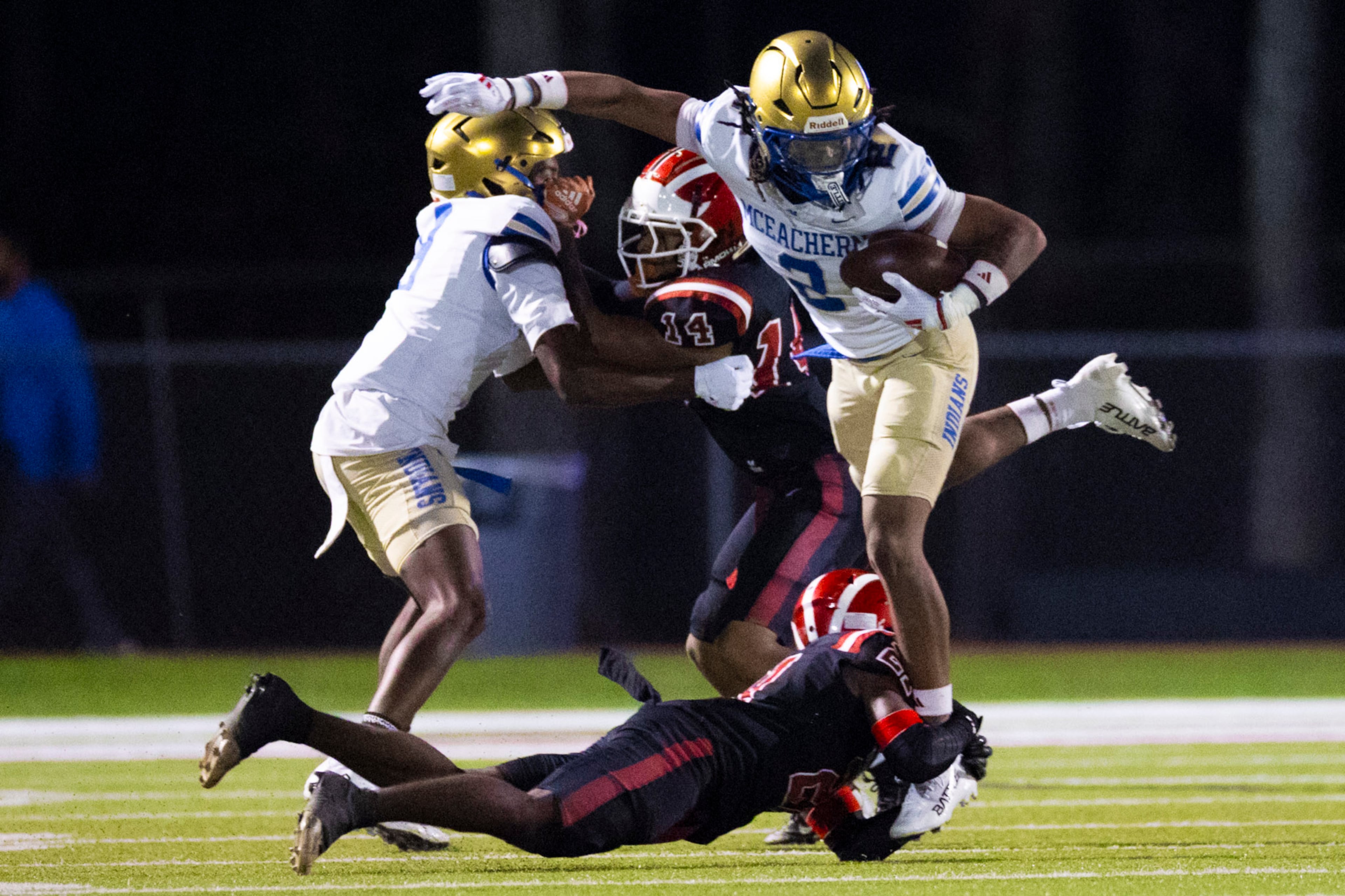 McEachern wide receiver Nalin Scott (2) dodges a tackle against Hillgrove at Cobb Energy Hillgrove Stadium in Powder Springs, GA on Friday, October 17th, 2025. (Oscar Guevara Saenz for the AJC)