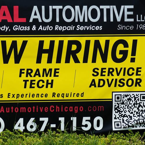 FILE - A now hiring sign is seen in front of an auto body shop in Chicago, June 25, 2026. (AP Photo/Nam Y. Huh, file)