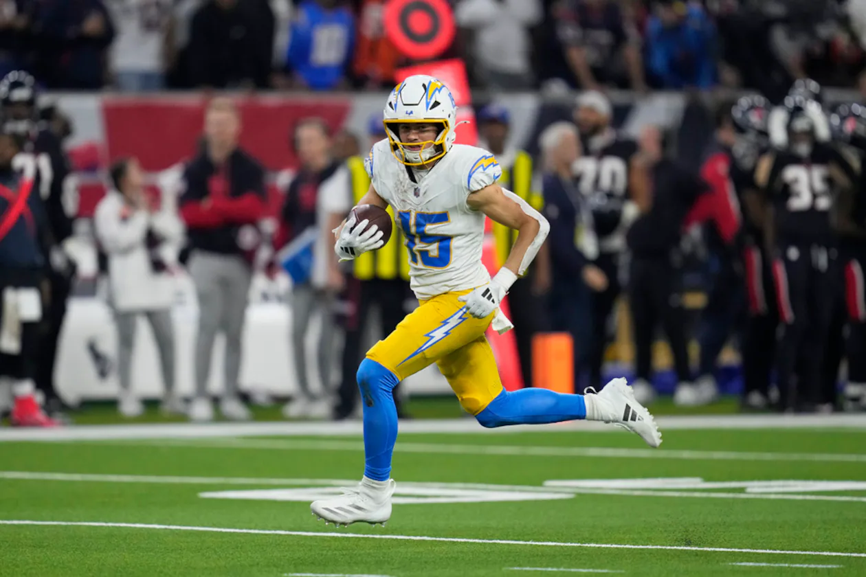 Los Angeles Chargers wide receiver Ladd McConkey runs toward the end zone after catching a pass to score a touchdown against the Houston Texans during the second half of an NFL wild-card playoff football game Saturday, Jan. 11, 2025, in Houston. (AP Photo/Ashely Landis)