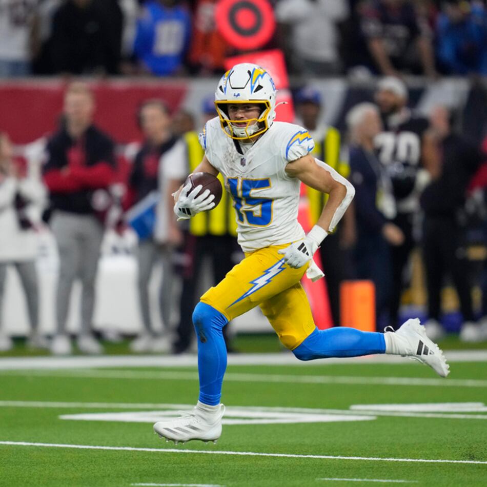 Los Angeles Chargers wide receiver Ladd McConkey runs toward the end zone after catching a pass to score a touchdown against the Houston Texans during the second half of an NFL wild-card playoff football game Saturday, Jan. 11, 2025, in Houston. (AP Photo/Ashely Landis)